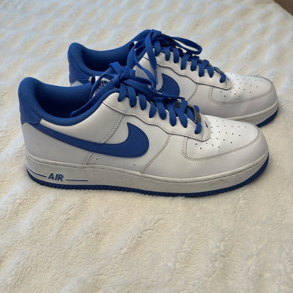 Nike Air Force 1 White Low-Top Sneakers with Blue Swoosh